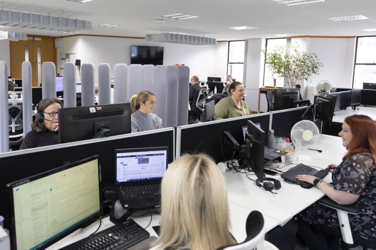 A busy open-plan floor with members at work