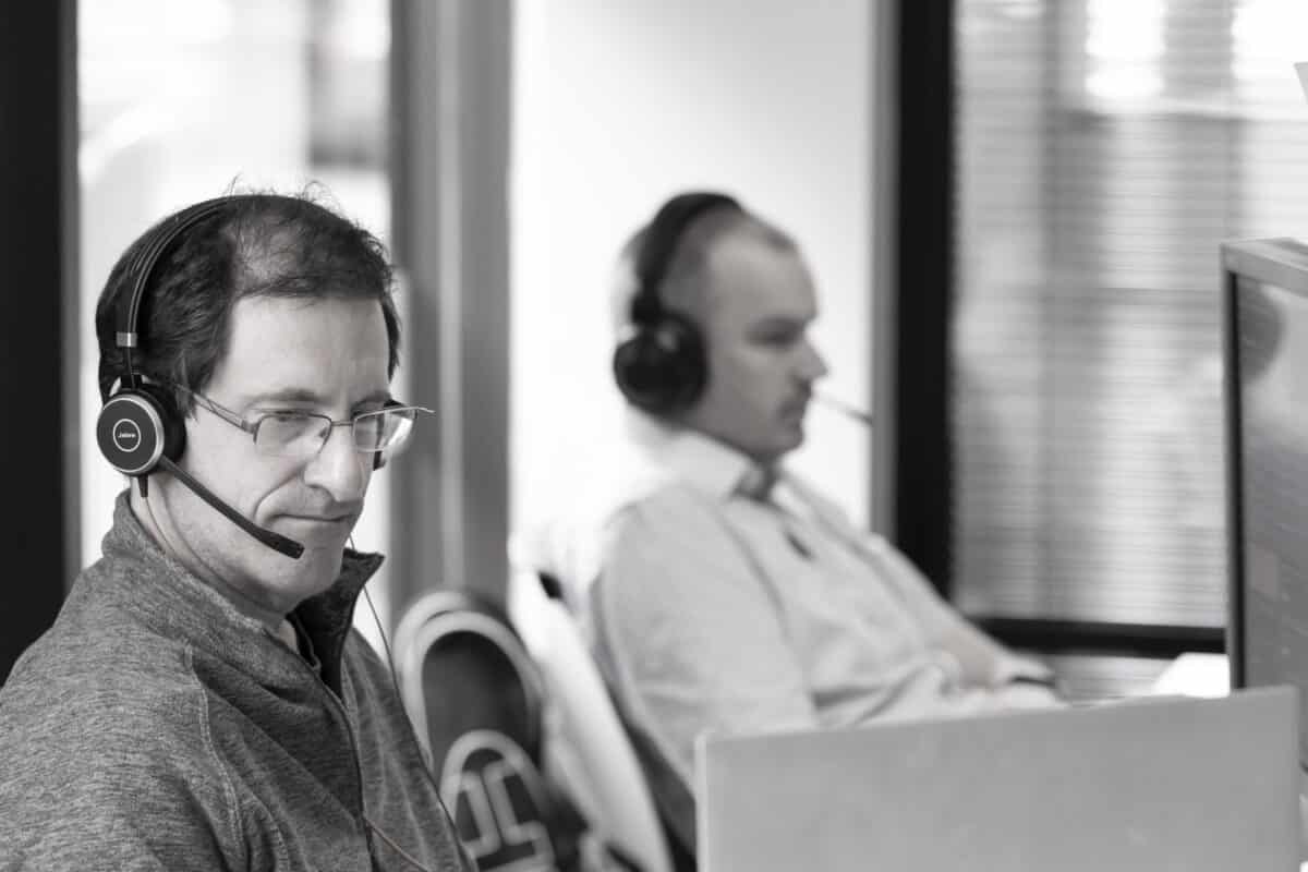 Members focused at work, in black and white