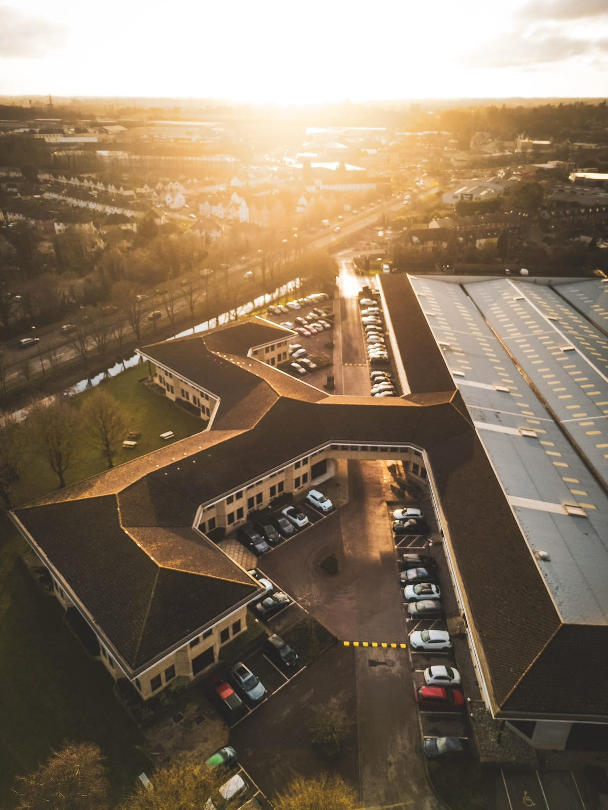 The zigzag rooftops of Watermoor Point at sunset, from above