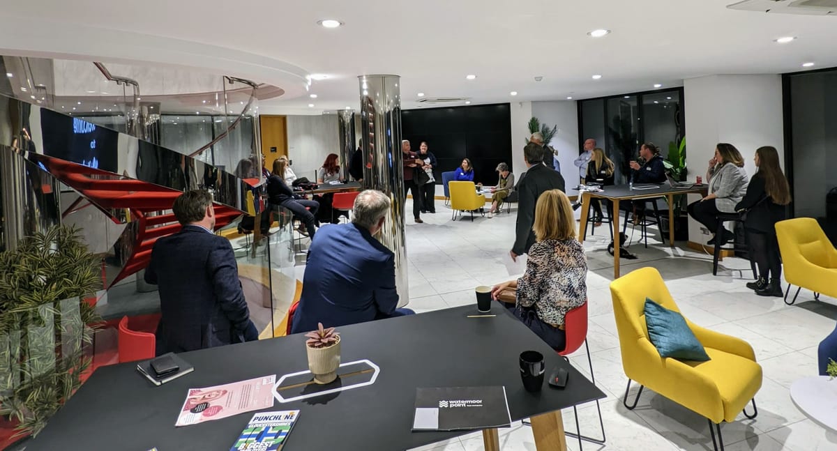 The business lounge set up for a presentation, with breakout seating