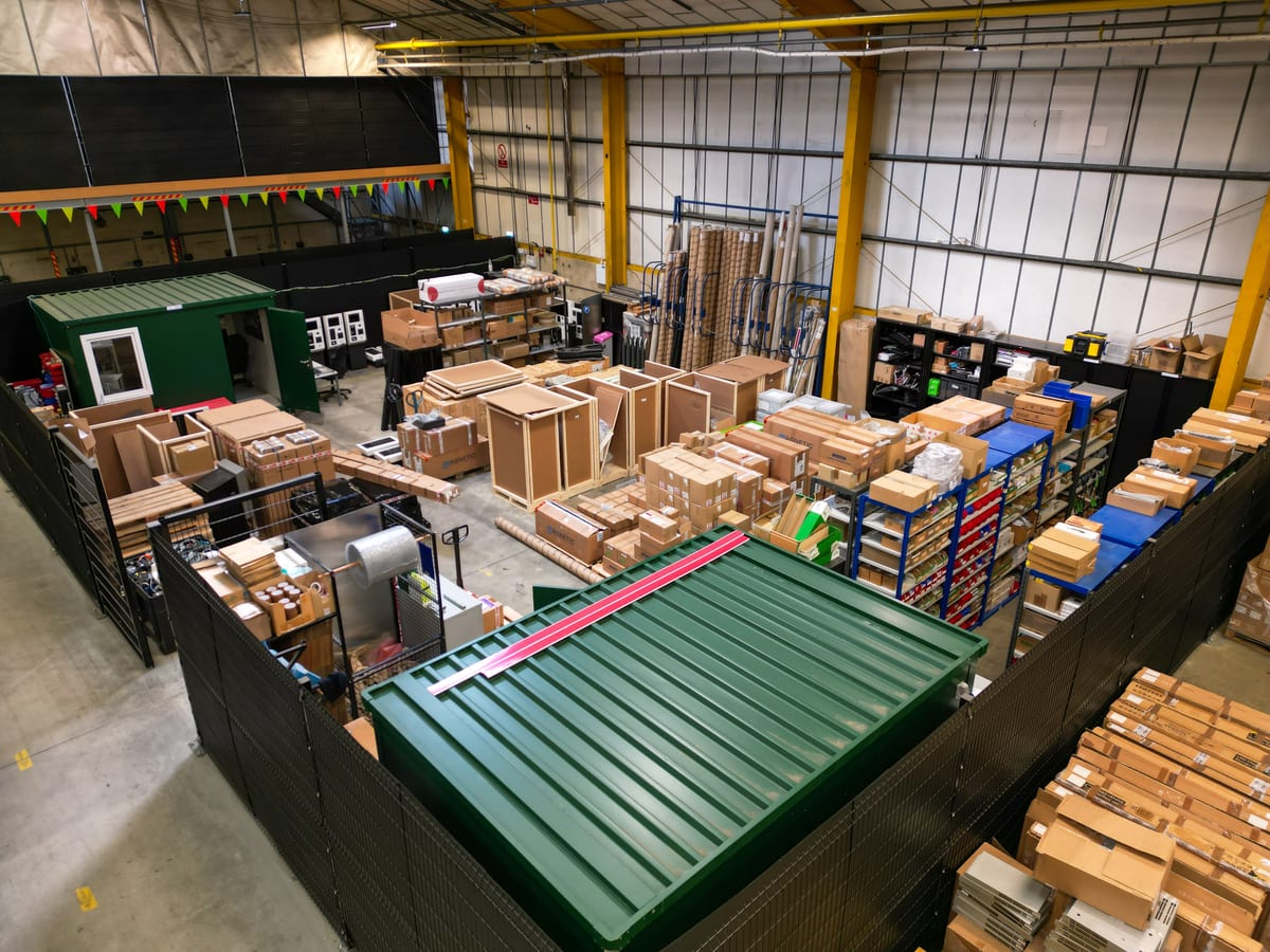 Aerial view inside a co-warehousing unit stacked with pallets and boxes