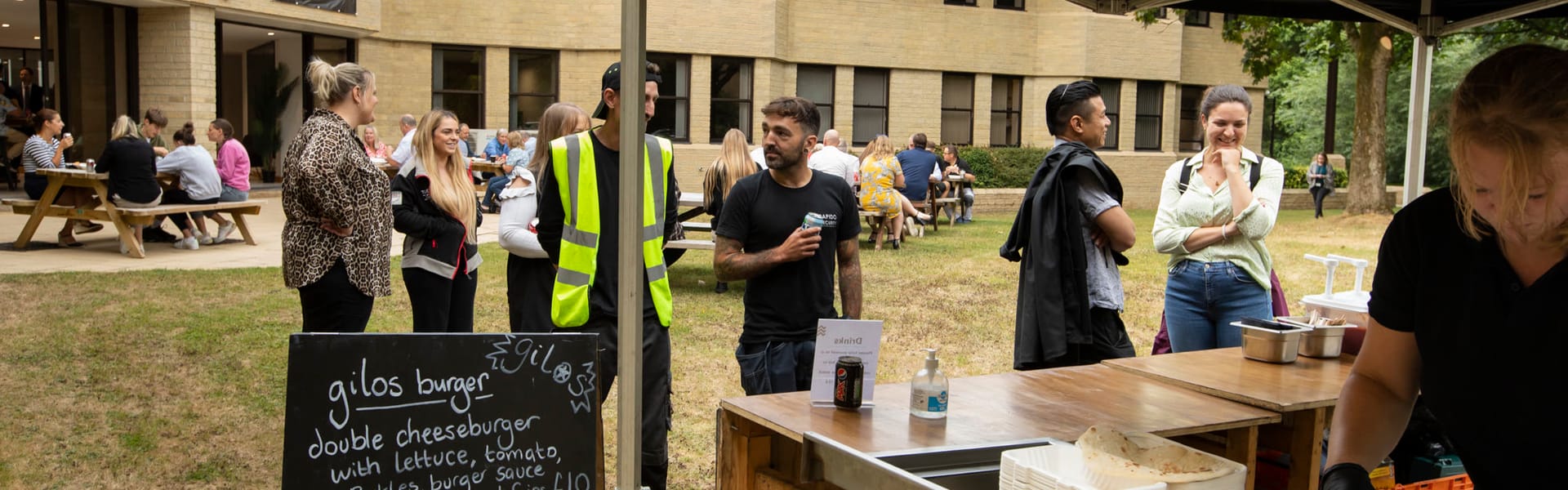 Members and visitors at a summer party in the Watermoor Point parkland
