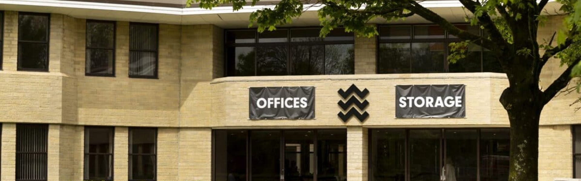 The Watermoor Point building, with offices and storage, set in parkland