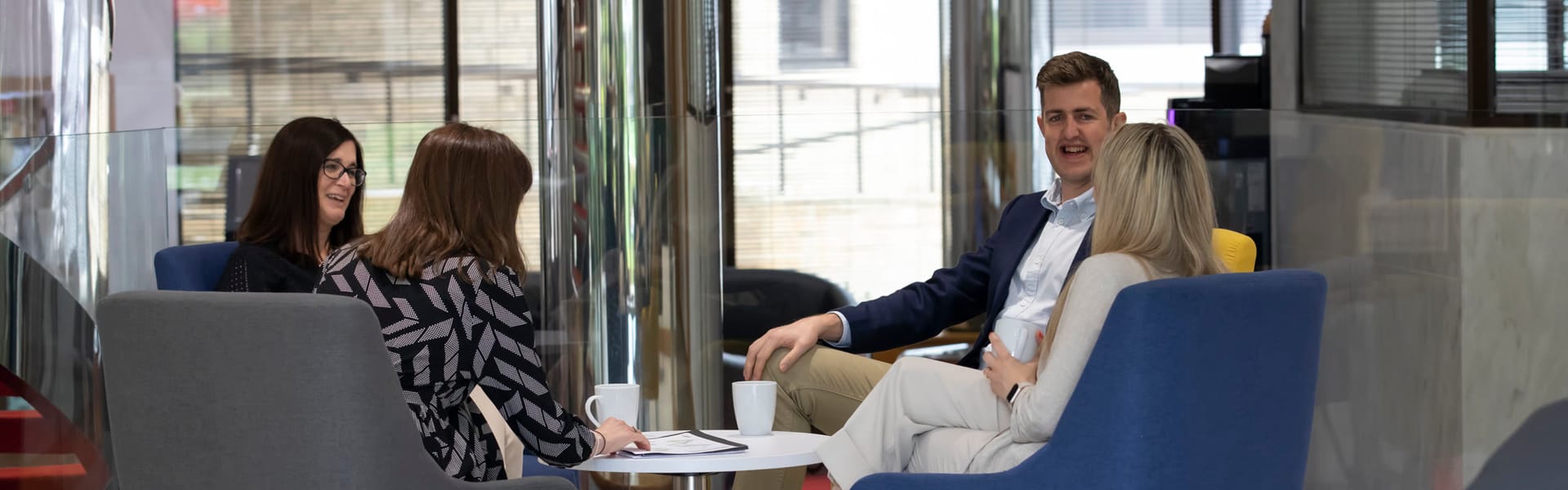 Members talking over coffee in the business lounge