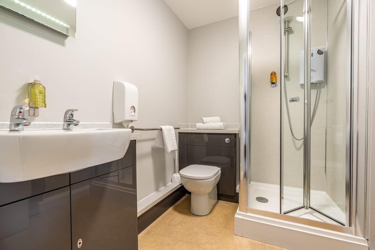 A modern en-suite shower room at Riverside Hotel