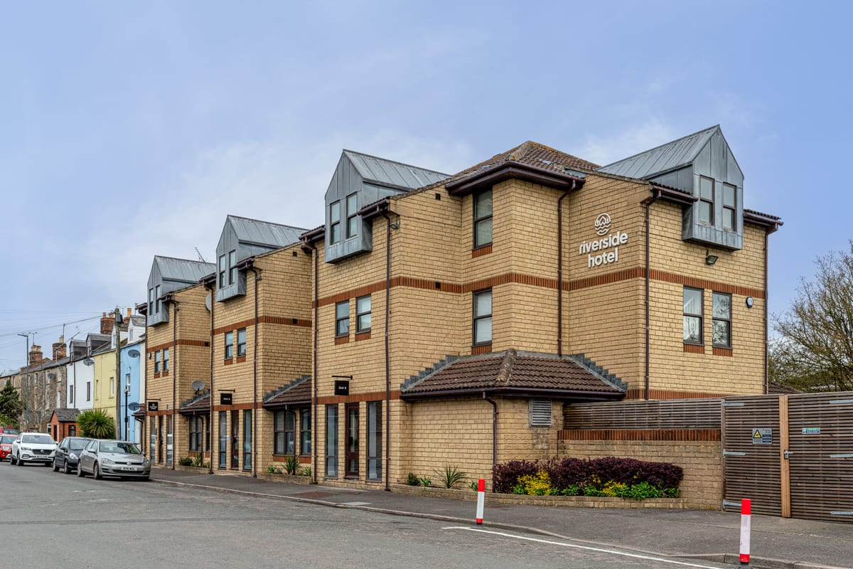 The Riverside Hotel building at the entrance to Watermoor Point