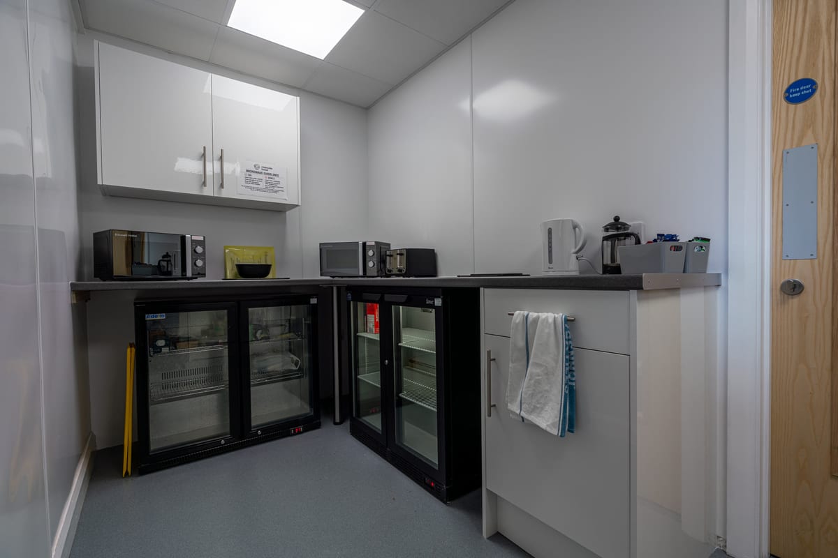 The fully equipped communal kitchen at Riverside Hotel