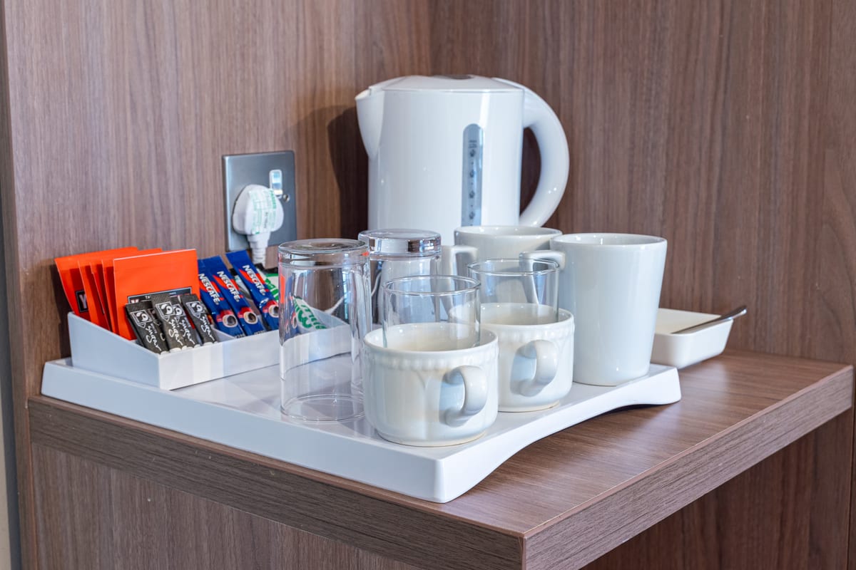 Complimentary tea and coffee tray in a Riverside hotel room