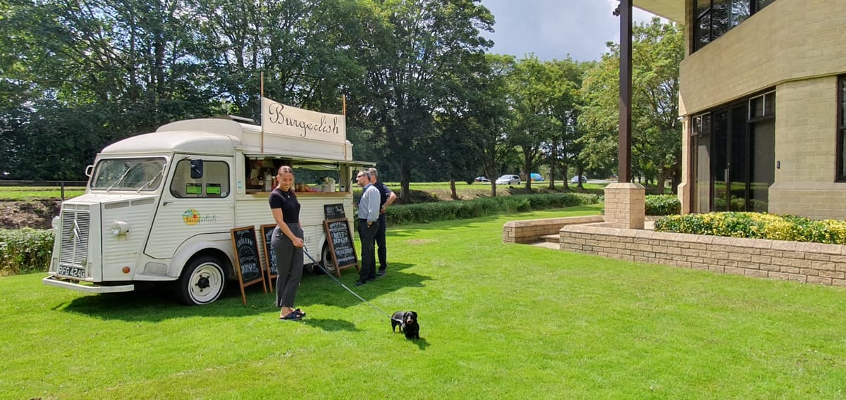 A food truck serving lunch on the grounds